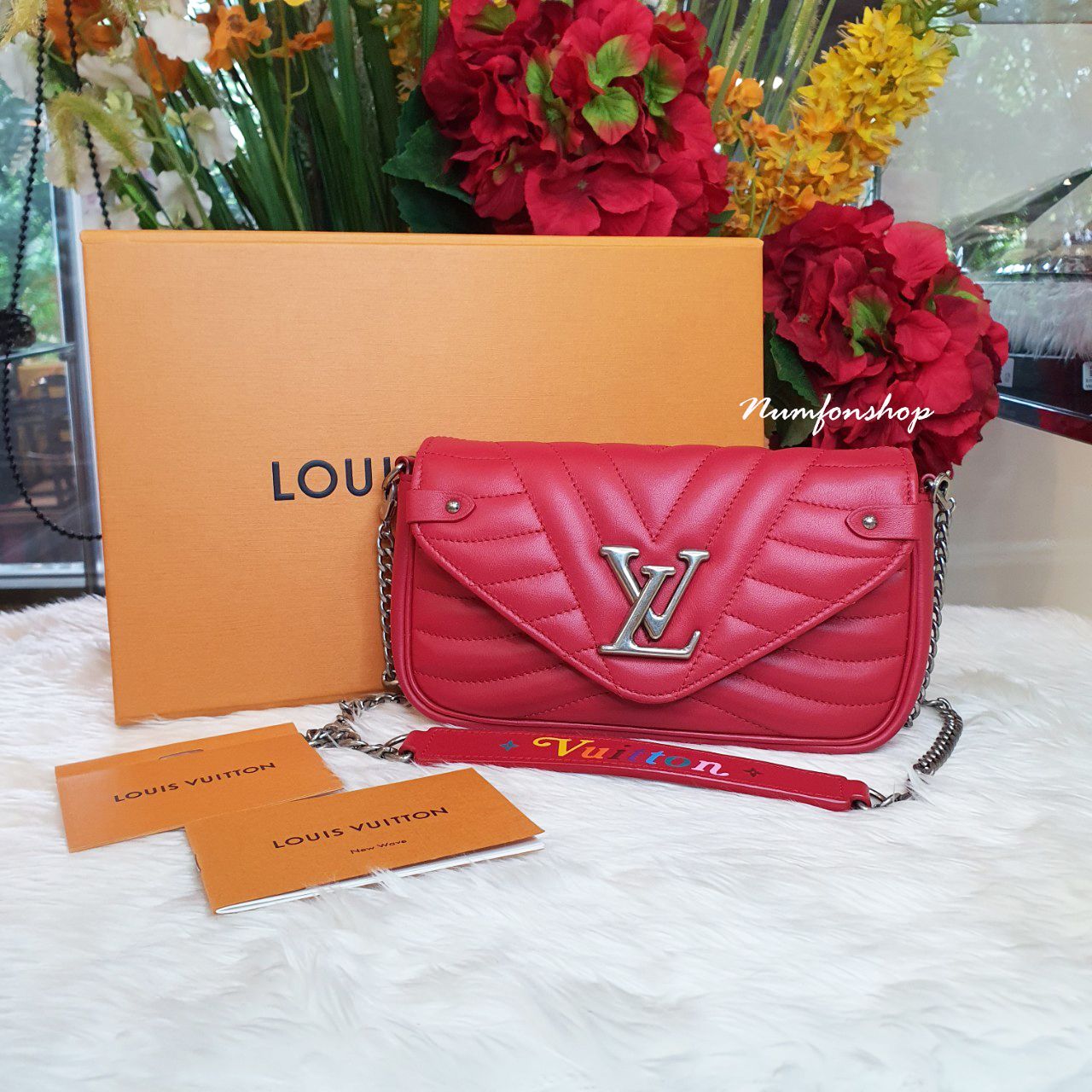 Sold Louis Vuitton Pochette New Wave Like New.